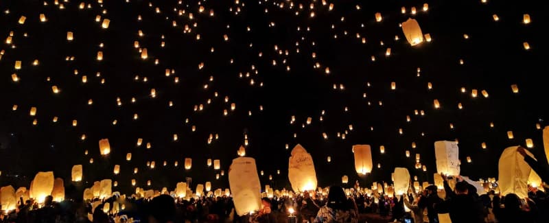 Hundreds of lanterns launched into the evening sky